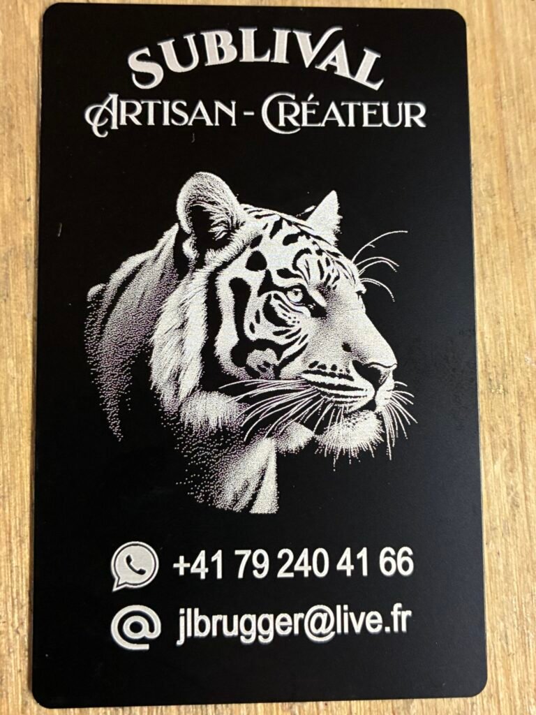 Black card with a white tiger head illustration and the words 'SUBLIVAL ARTISAN-CRÉATEUR' at the top, plus contact info at the bottom.